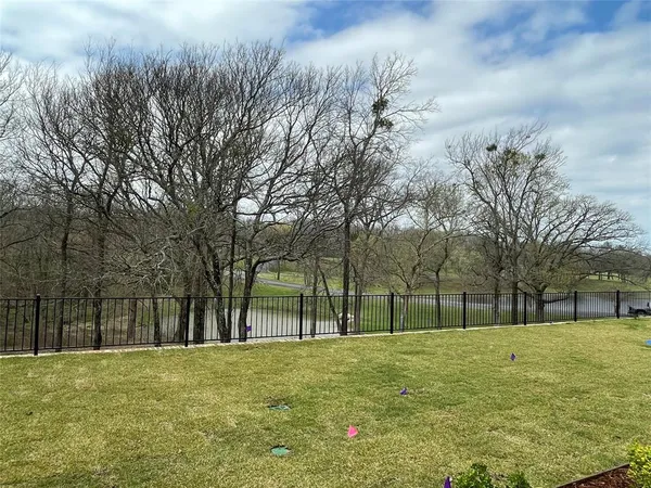 a view of swimming pool with trees in the background