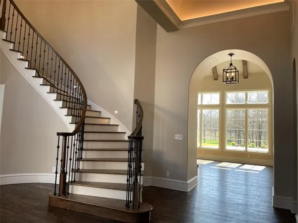 a view of entryway with wooden floor