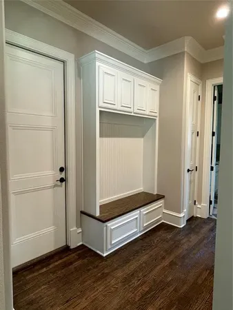 a view of room with wooden floor