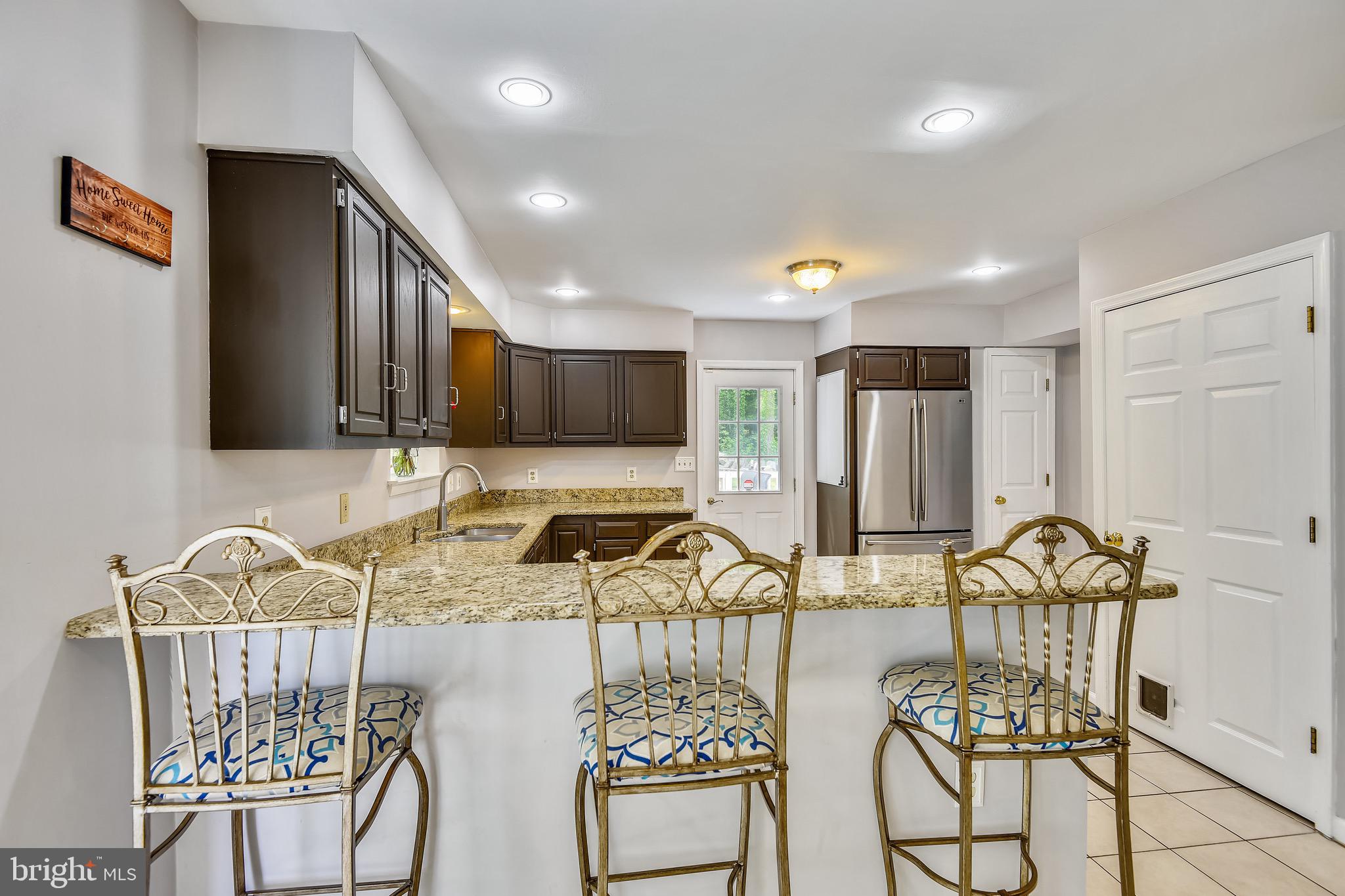 73 Sheridan Road Arnold, MD 21012 - Photo 14 of 35 Countertop seating for three.