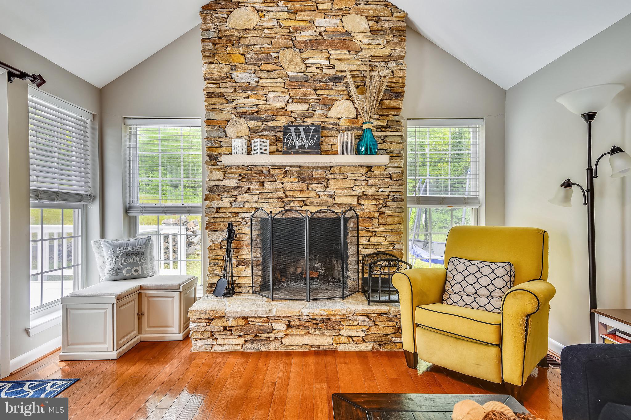 73 Sheridan Road Arnold, MD 21012 - Photo 8 of 35 Views of the fireplace and woods out back.