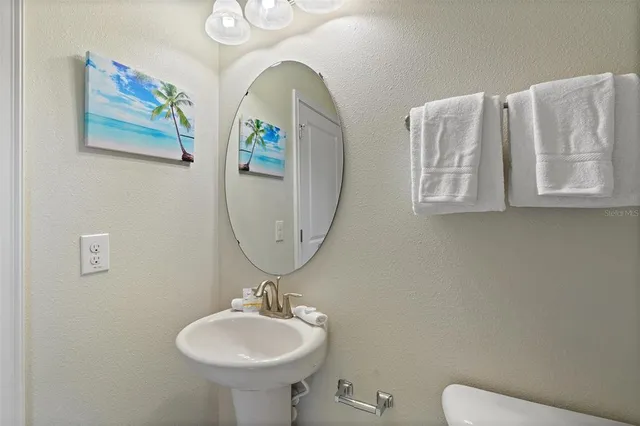 a view of a patio with dining table and chairs