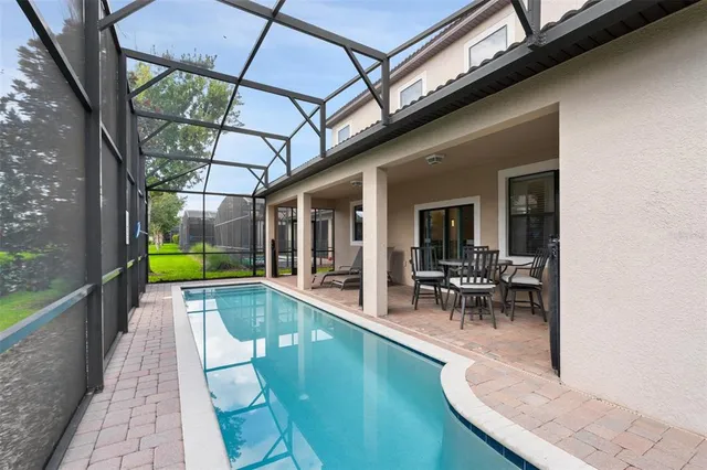 a bedroom with two beds and window