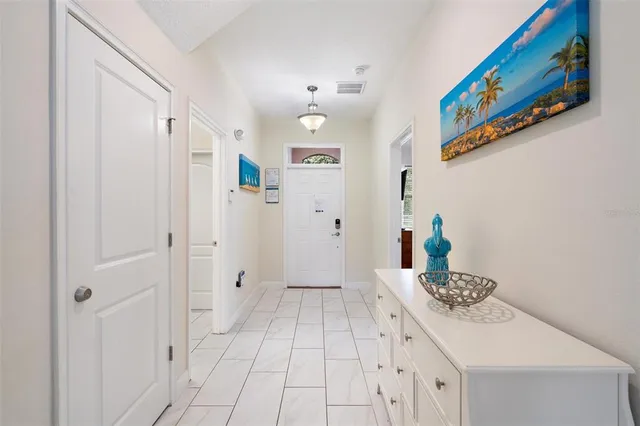 a bedroom with a bed and a mirror