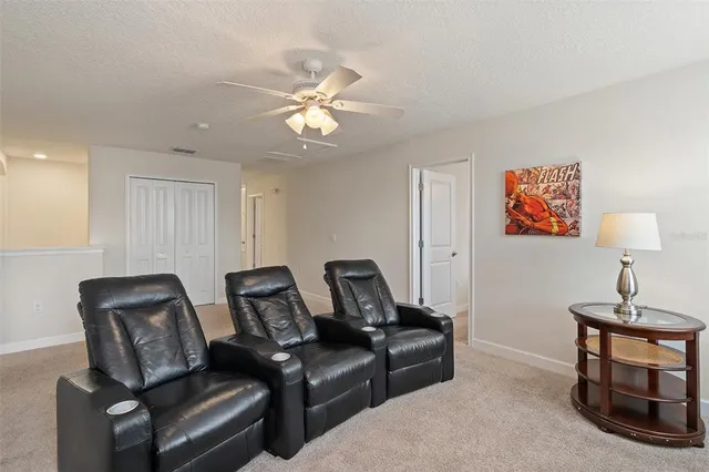 a bathroom with a granite countertop sink toilet a mirror and shower