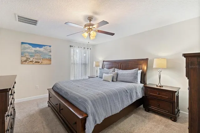 a white bath tub sitting next to a shower
