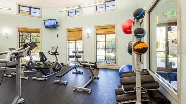 a view of a swimming pool with a lawn chairs next to yard