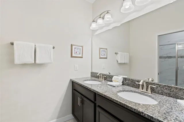 a dining room with kitchen island furniture a chandelier and kitchen view