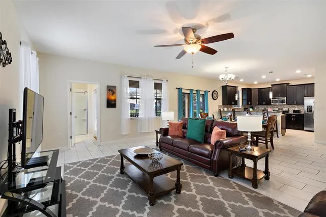 a kitchen with kitchen island granite countertop wooden cabinets and stainless steel appliances