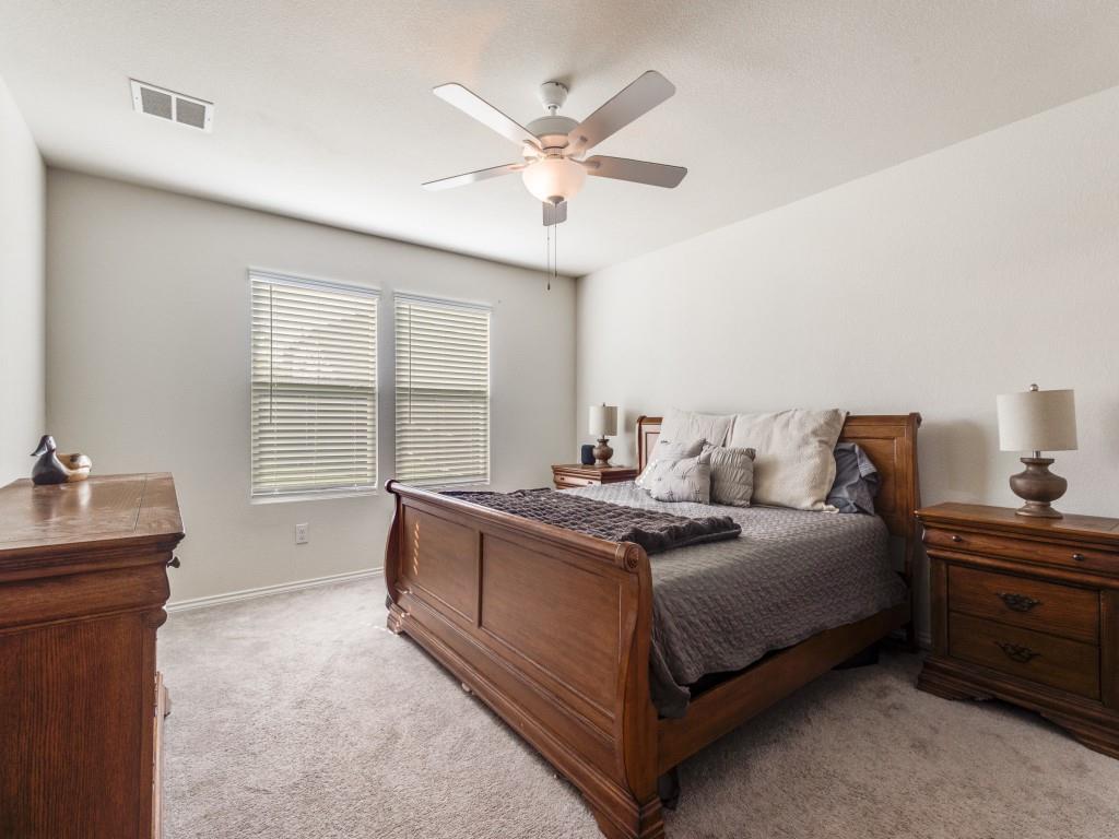 16033 Pemberly Lane Haslet, TX 76052 - Photo 16 of 27 a bedroom with a bed and a table