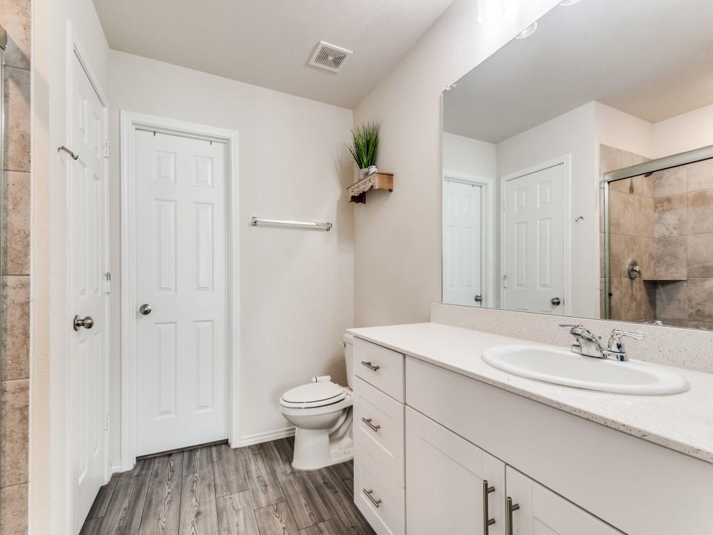 16033 Pemberly Lane Haslet, TX 76052 - Photo 18 of 27 a bathroom with a sink toilet and shower