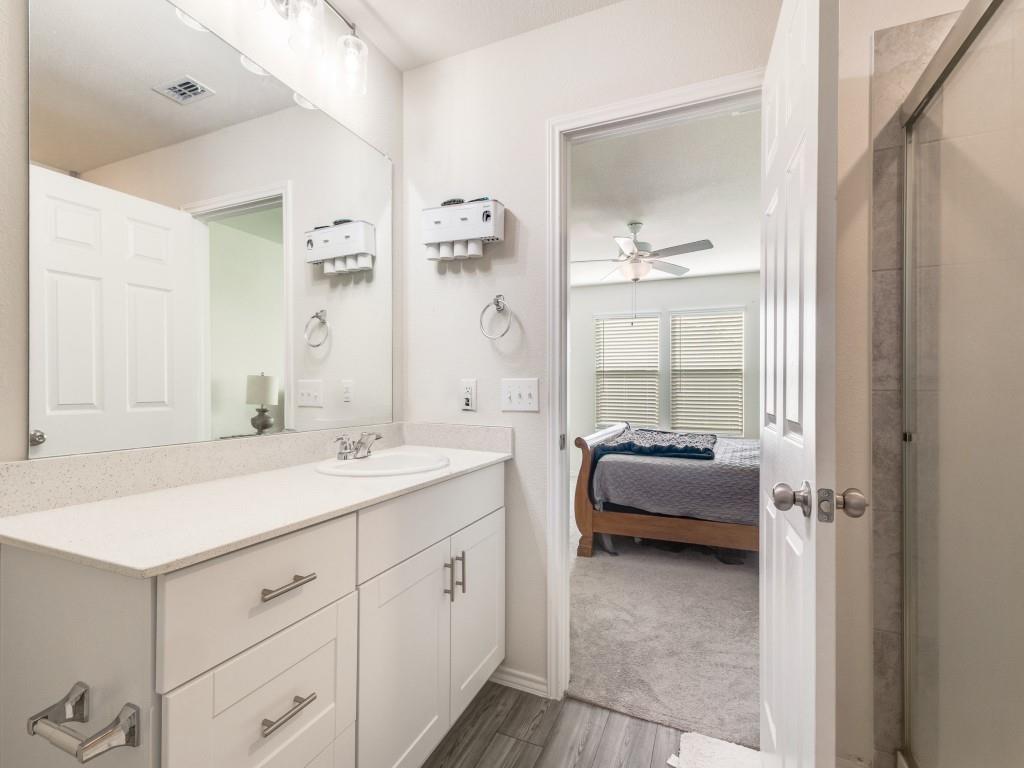16033 Pemberly Lane Haslet, TX 76052 - Photo 19 of 27 a en suite bathroom with a double vanity sink and a mirror