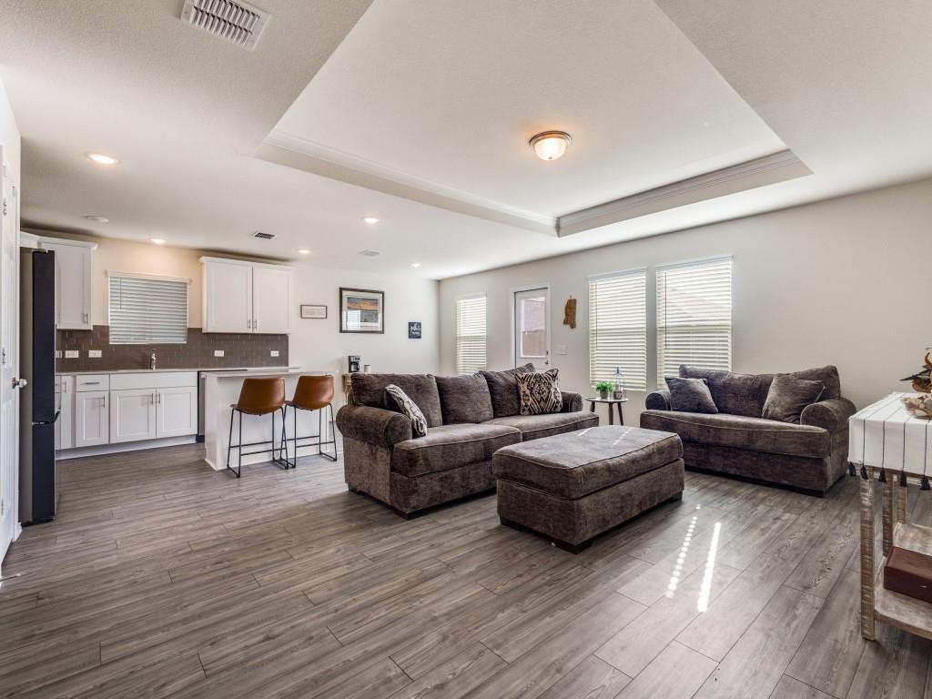 16033 Pemberly Lane Haslet, TX 76052 - Photo 9 of 27 a living room with furniture and kitchen view