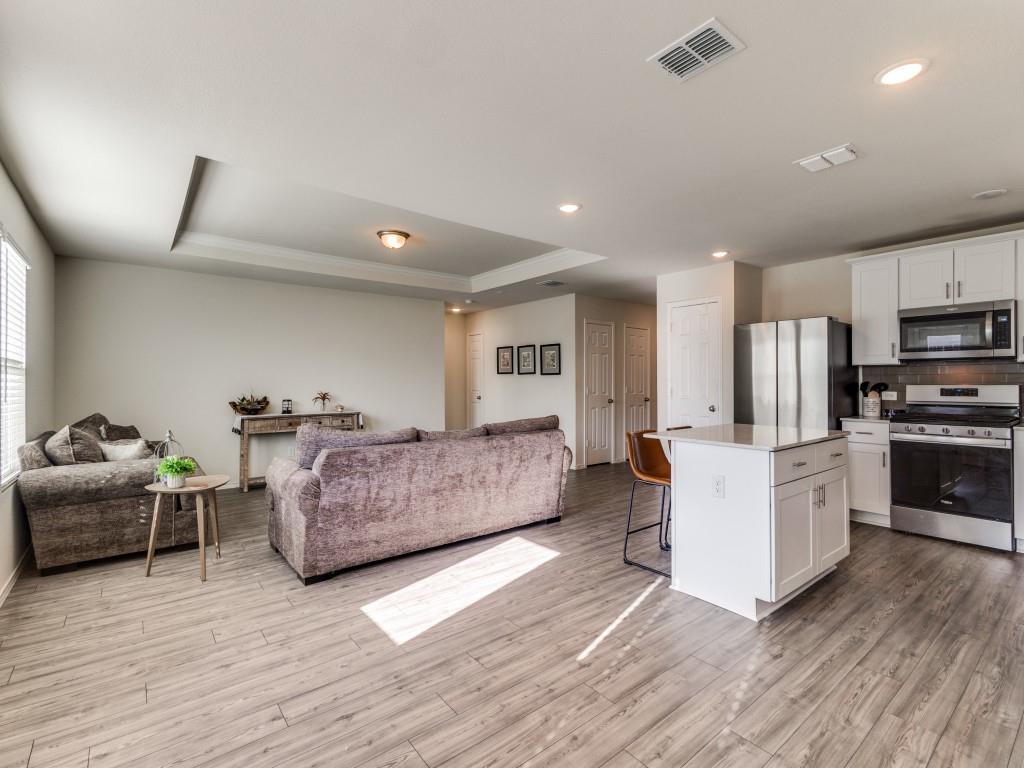 16033 Pemberly Lane Haslet, TX 76052 - Photo 10 of 27 a living room with furniture and a wooden floor