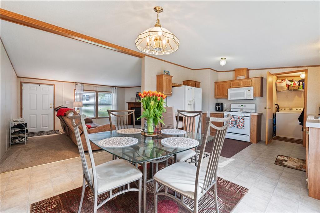 619 Deana Way Rochester, PA 15074 - Photo 7 of 29 The dining area exudes warmth and style with its open...well-lit design...bathed in natural light...it offers a welcoming ambiance for shared meals.