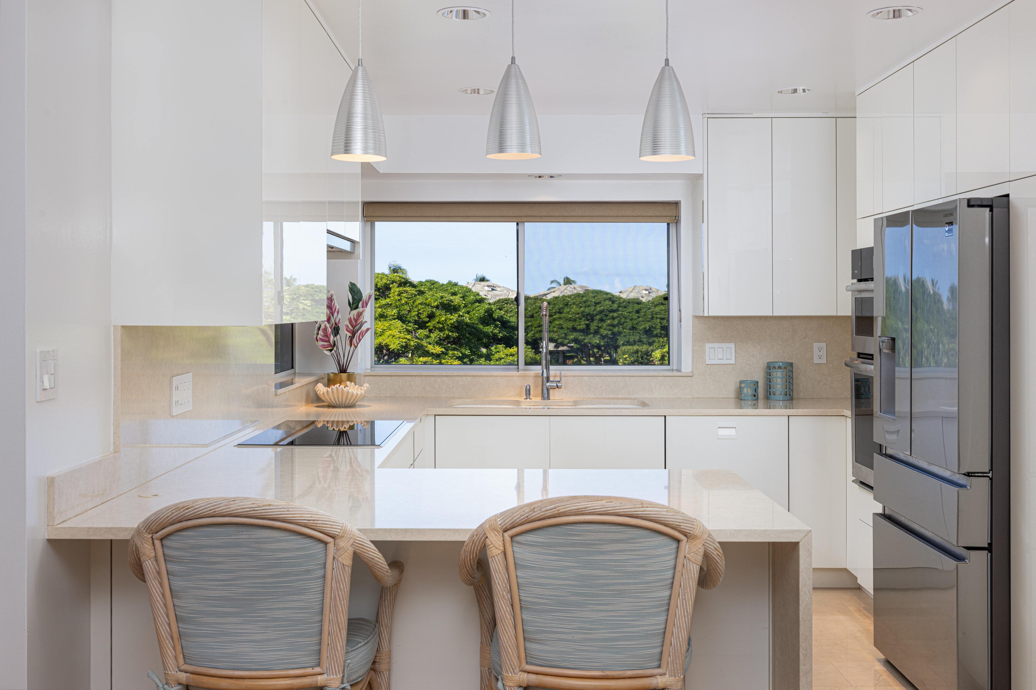 69-1010 Keana Place, Unit C202 Waikoloa, HI 96738 - Photo 12 of 30 a kitchen with a refrigerator and a sink