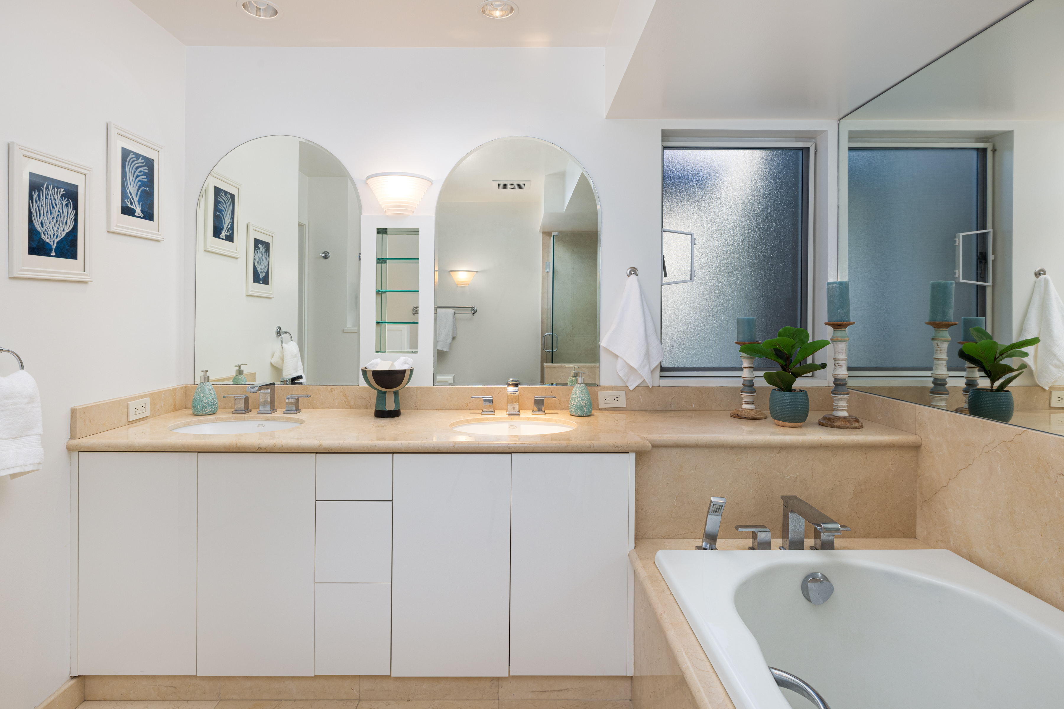 69-1010 Keana Place, Unit C202 Waikoloa, HI 96738 - Photo 19 of 30 a bathroom with a double vanity sink and a mirror