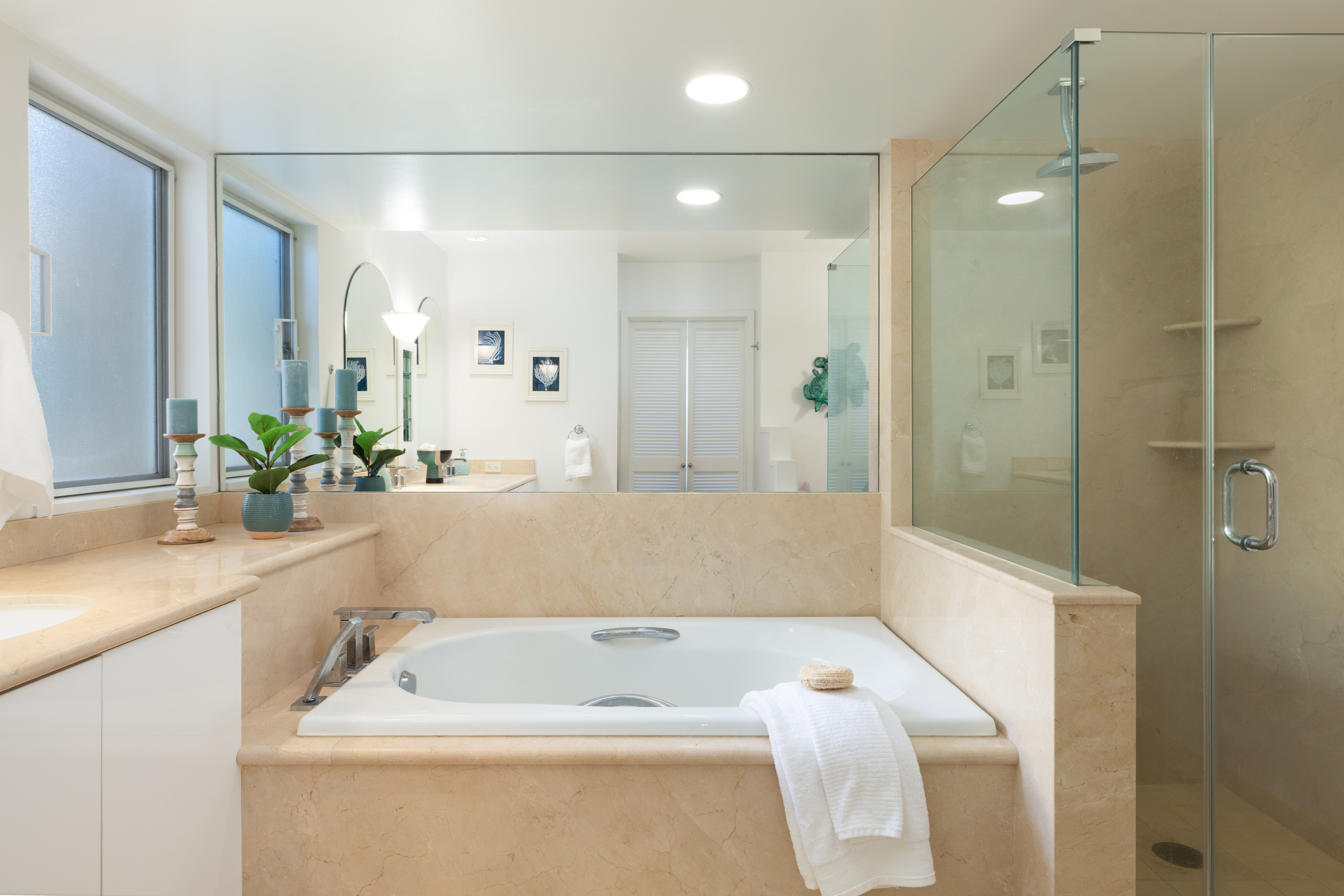 69-1010 Keana Place, Unit C202 Waikoloa, HI 96738 - Photo 20 of 30 a bathroom with a tub a sink and glass door shower