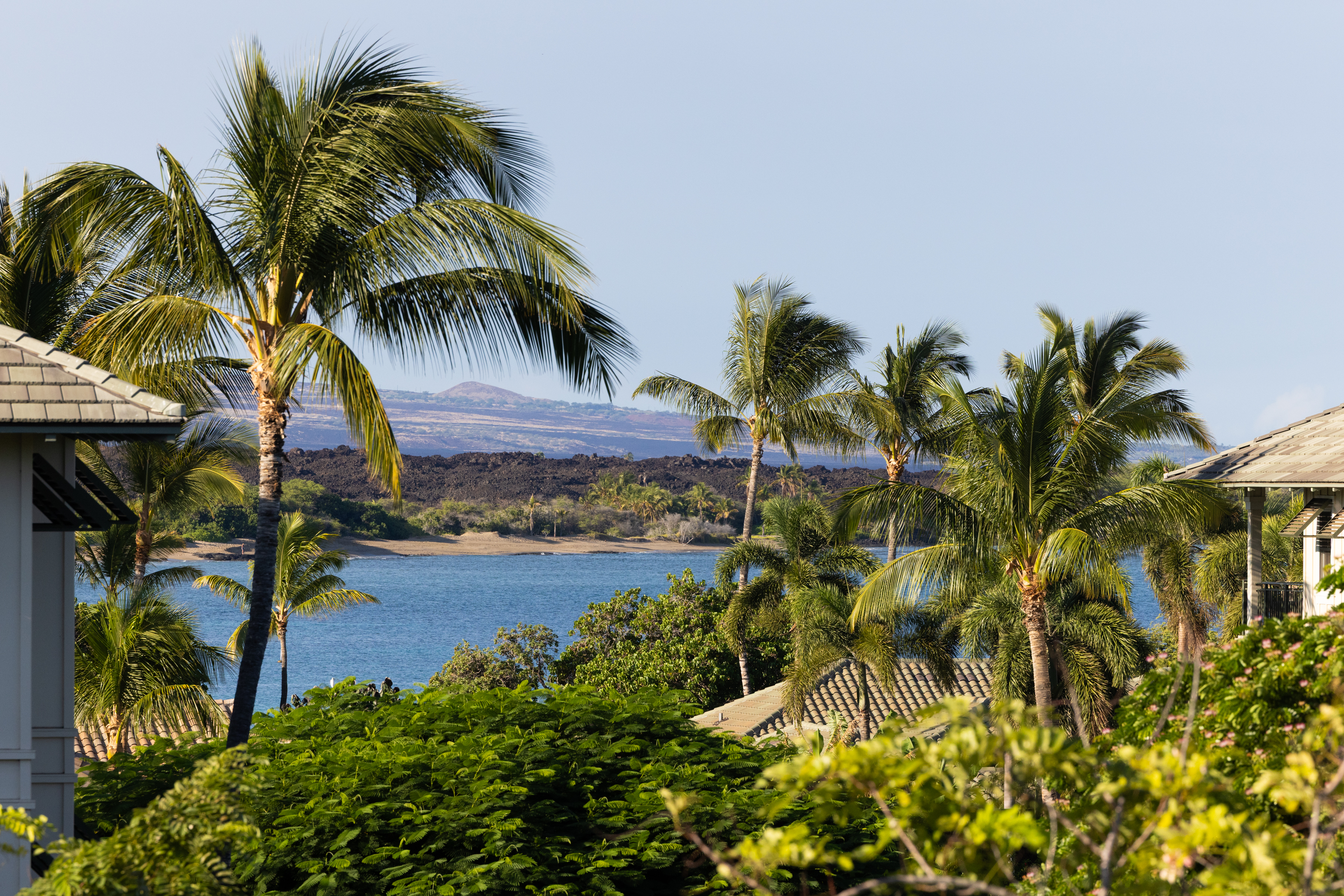69-1010 Keana Place, Unit C202 Waikoloa, HI 96738 - Photo 2 of 30 a backyard of a house with table and chairs