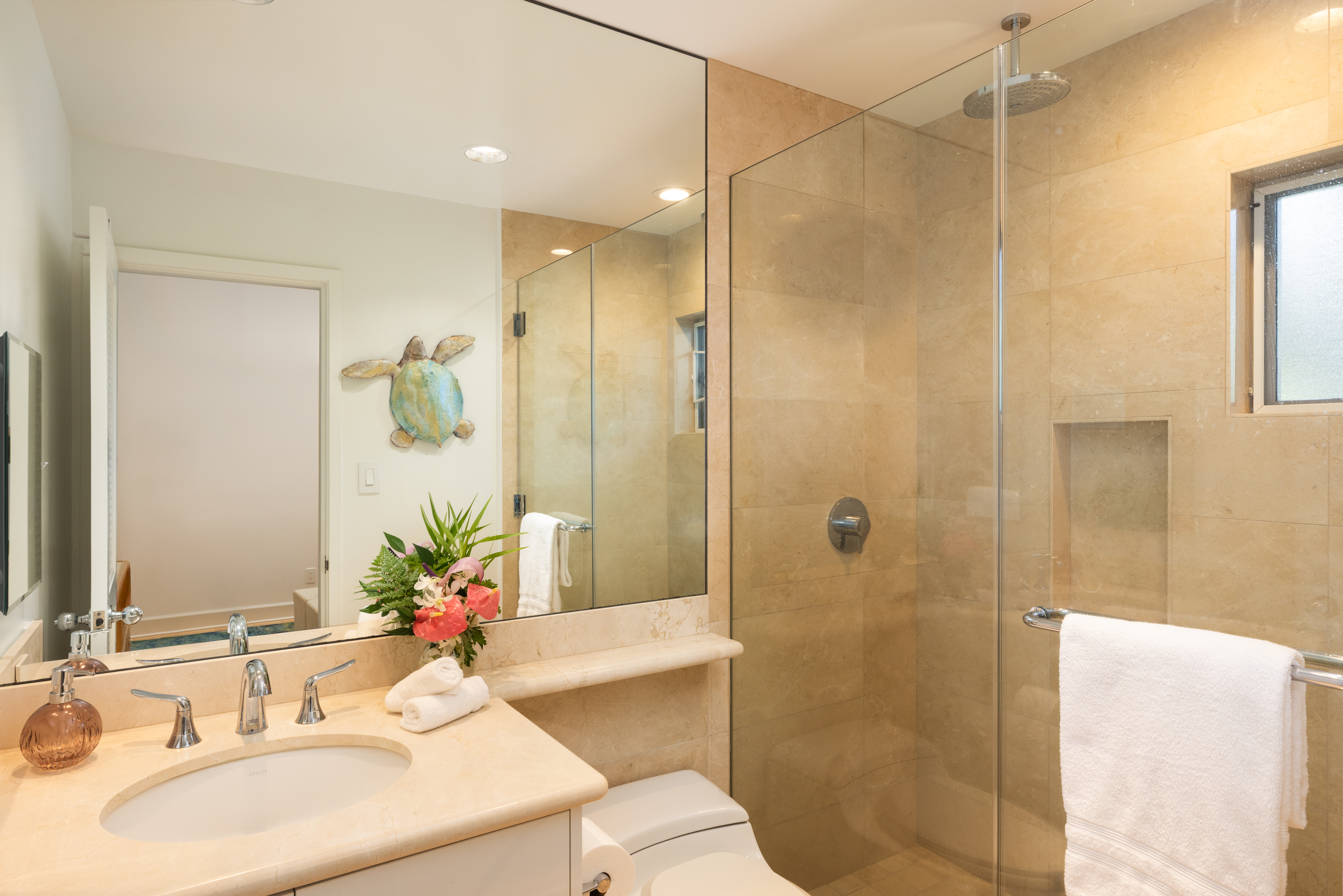 69-1010 Keana Place, Unit C202 Waikoloa, HI 96738 - Photo 23 of 30 a bathroom with a sink shower and a mirror