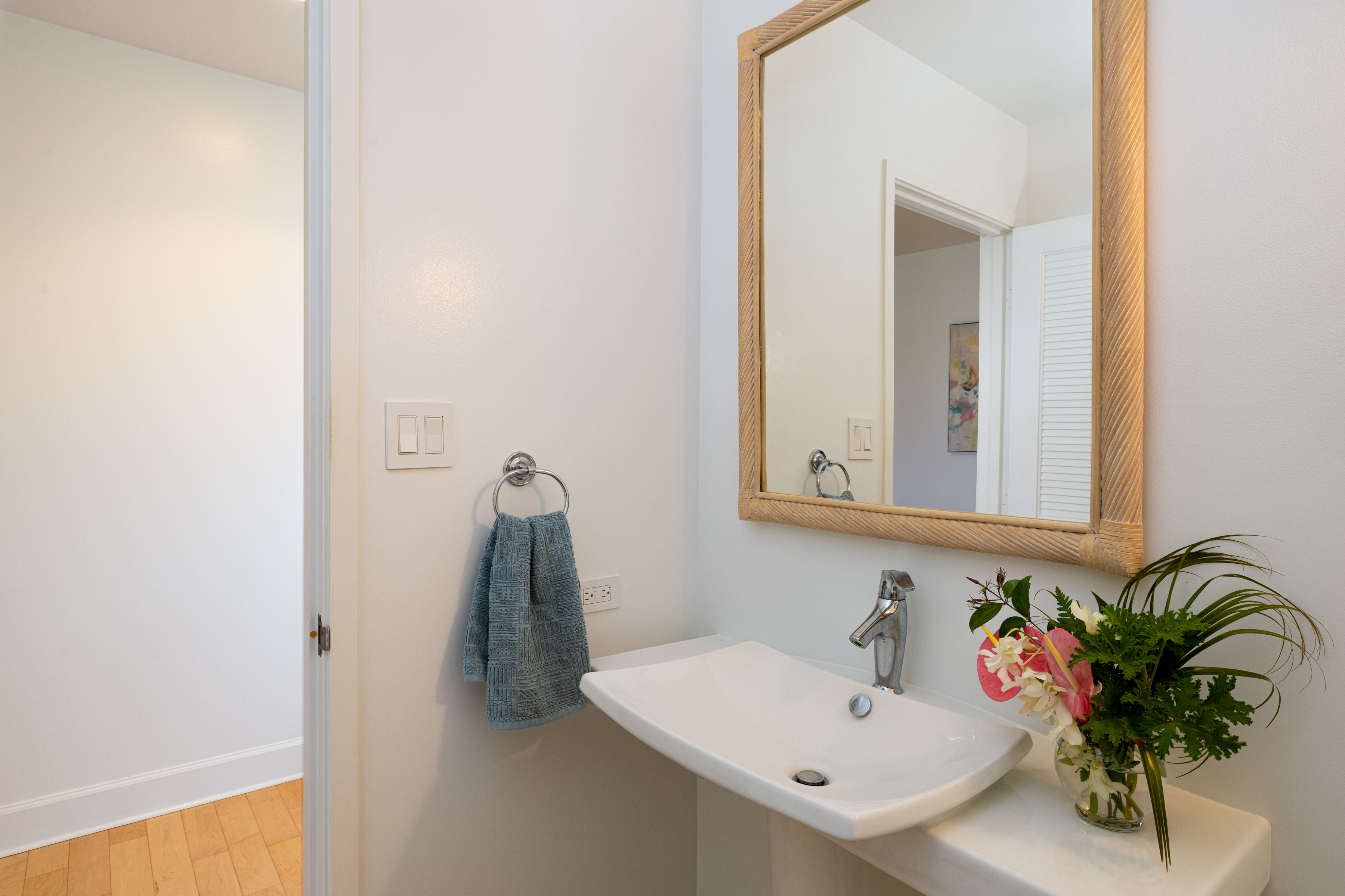 69-1010 Keana Place, Unit C202 Waikoloa, HI 96738 - Photo 24 of 30 a bathroom with a sink and a mirror