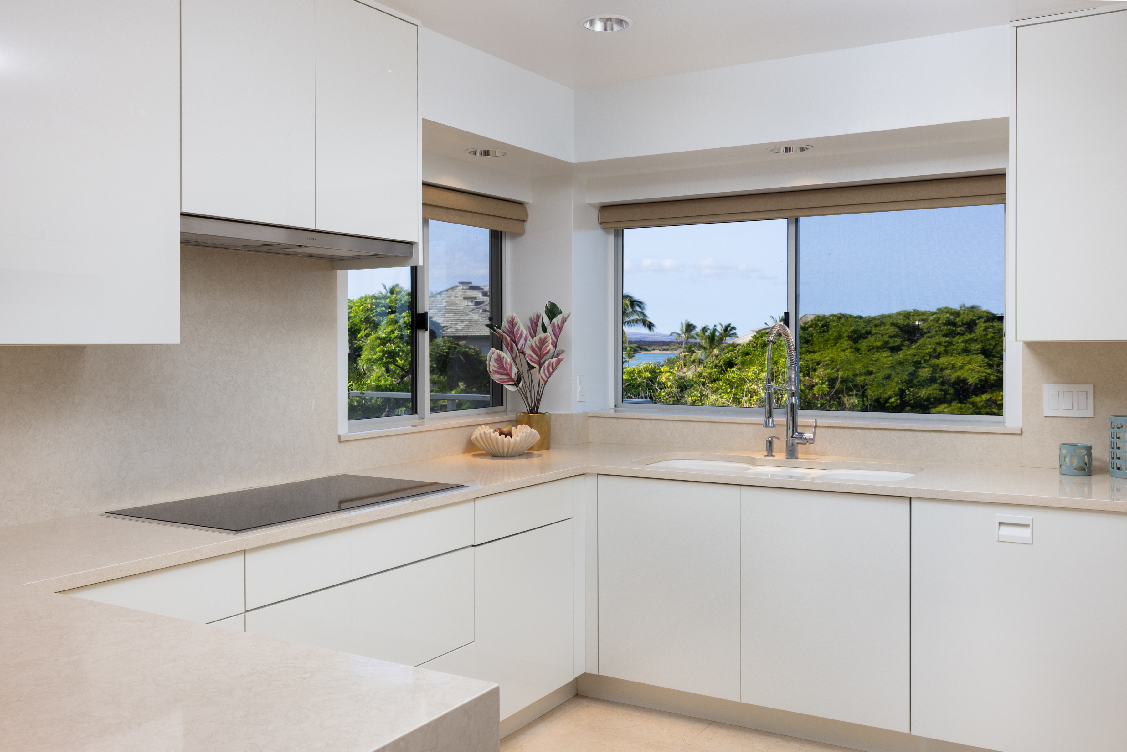 69-1010 Keana Place, Unit C202 Waikoloa, HI 96738 - Photo 3 of 30 a kitchen with a sink and large window
