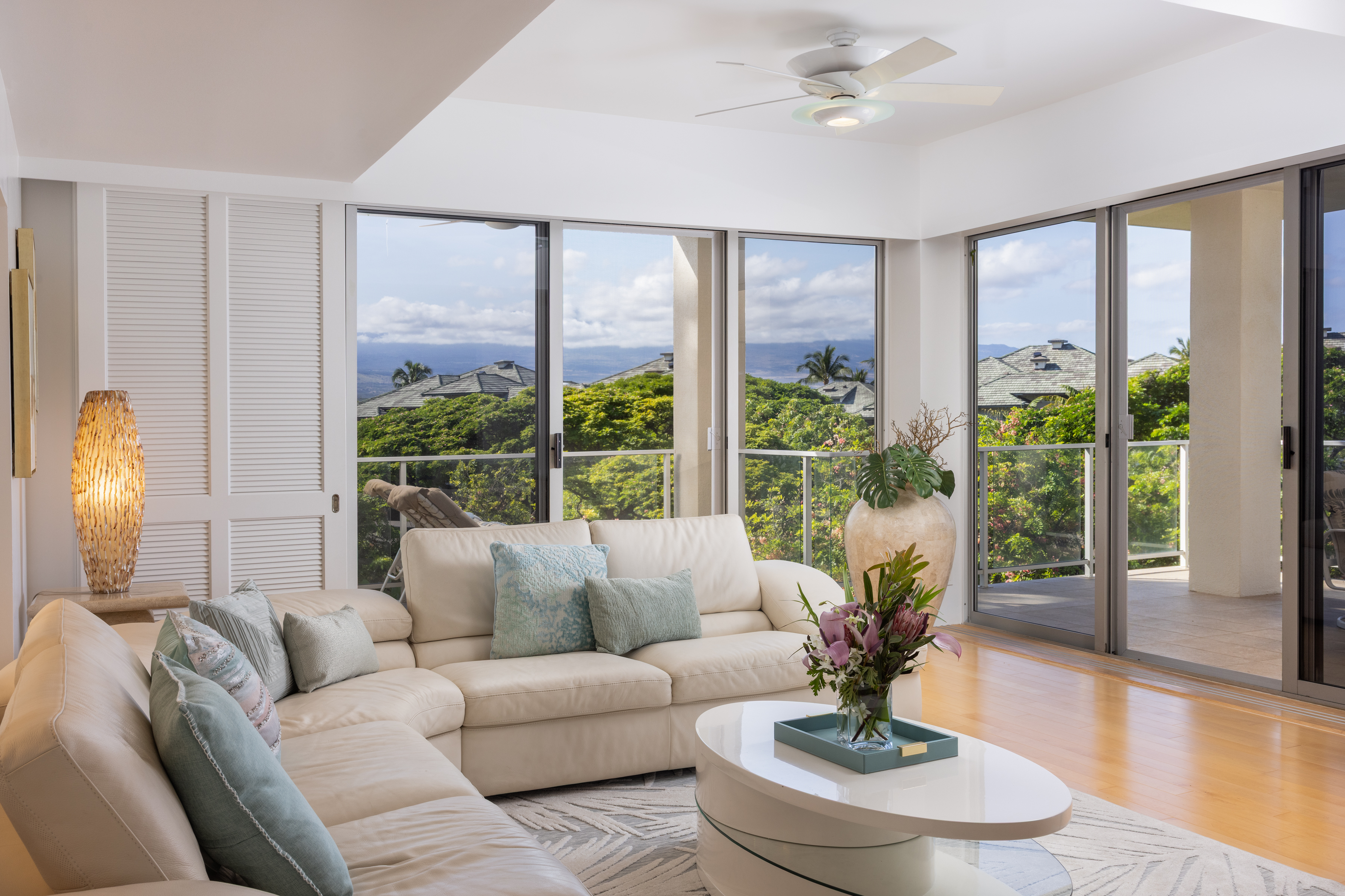 69-1010 Keana Place, Unit C202 Waikoloa, HI 96738 - Photo 4 of 30 a living room with furniture and a large window with garden view