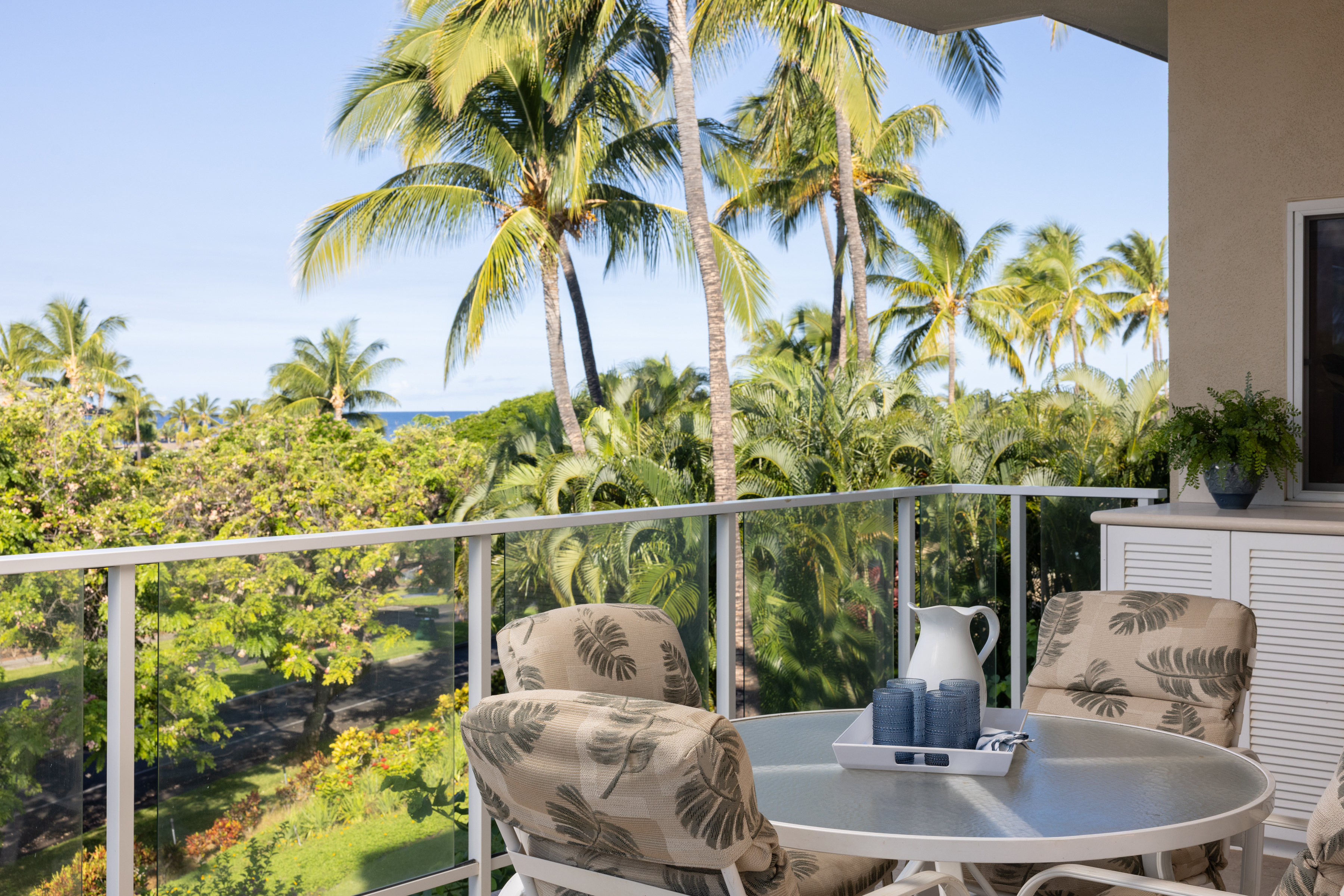 69-1010 Keana Place, Unit C202 Waikoloa, HI 96738 - Photo 6 of 30 a view of balcony with a potted plant and outdoor seating
