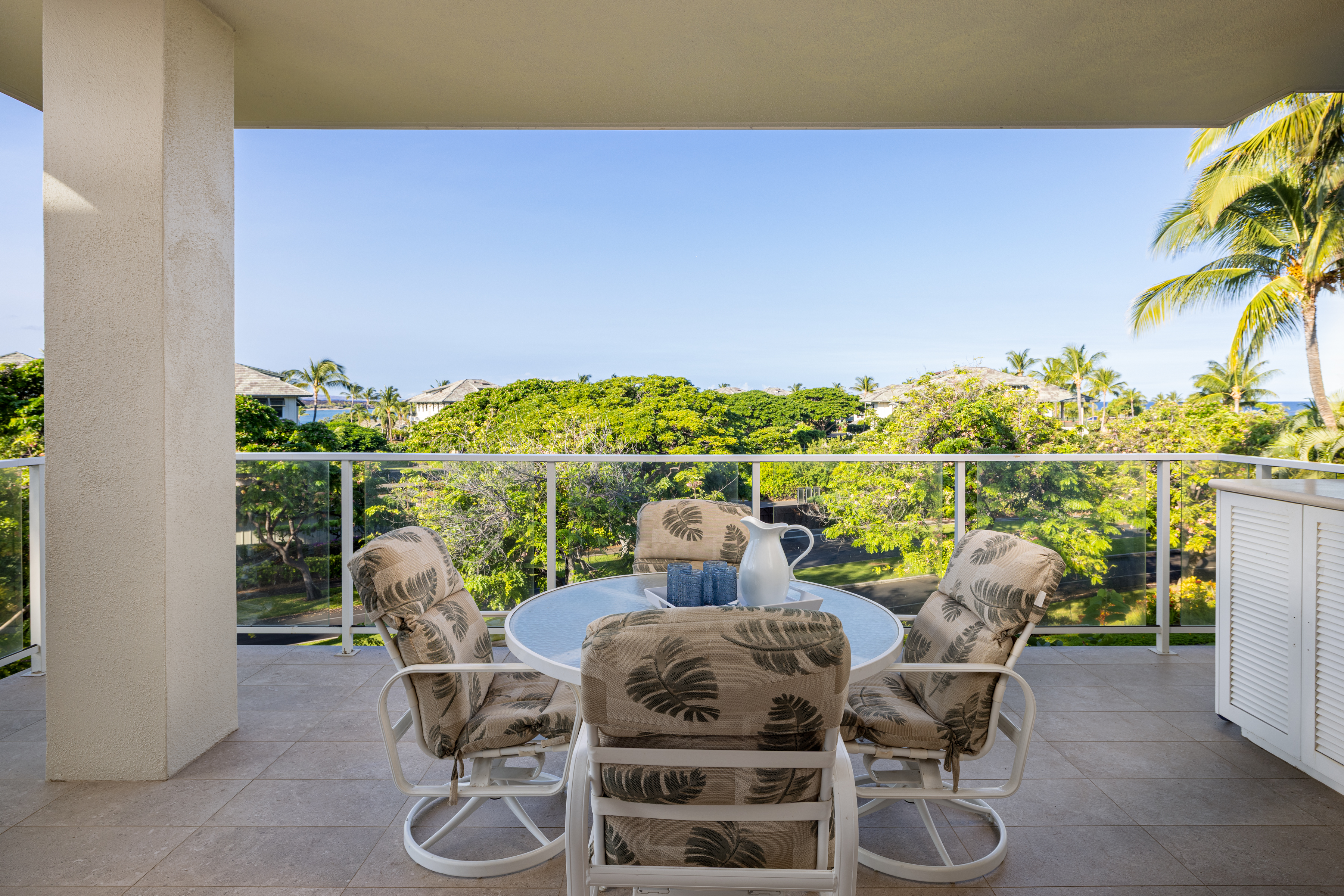 69-1010 Keana Place, Unit C202 Waikoloa, HI 96738 - Photo 7 of 30 a view of a chairs and table in the terrace