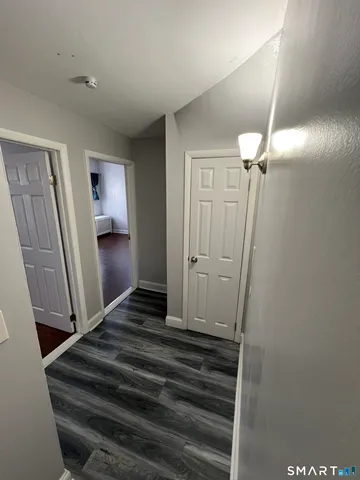 a view of a hallway view with staircase