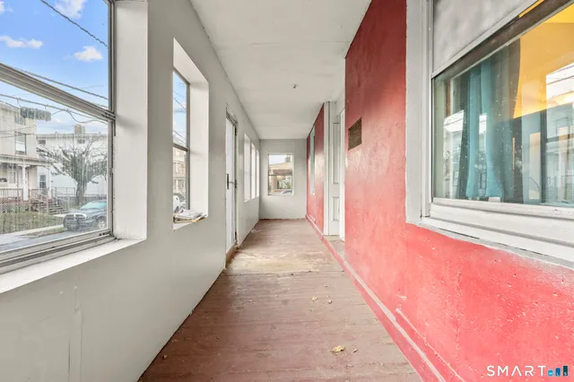 a view of a hallway with windows