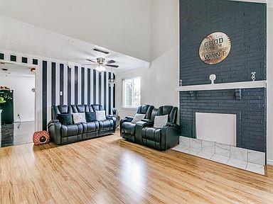 2930 Lancer Lane Garland, TX 75044 - Photo 2 of 11 a living room with furniture and a fireplace