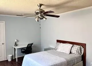 a bedroom with a bed and a table