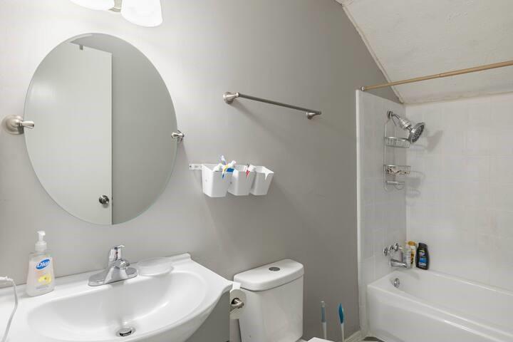 2930 Lancer Lane Garland, TX 75044 - Photo 9 of 11 a bathroom with a sink toilet and shower