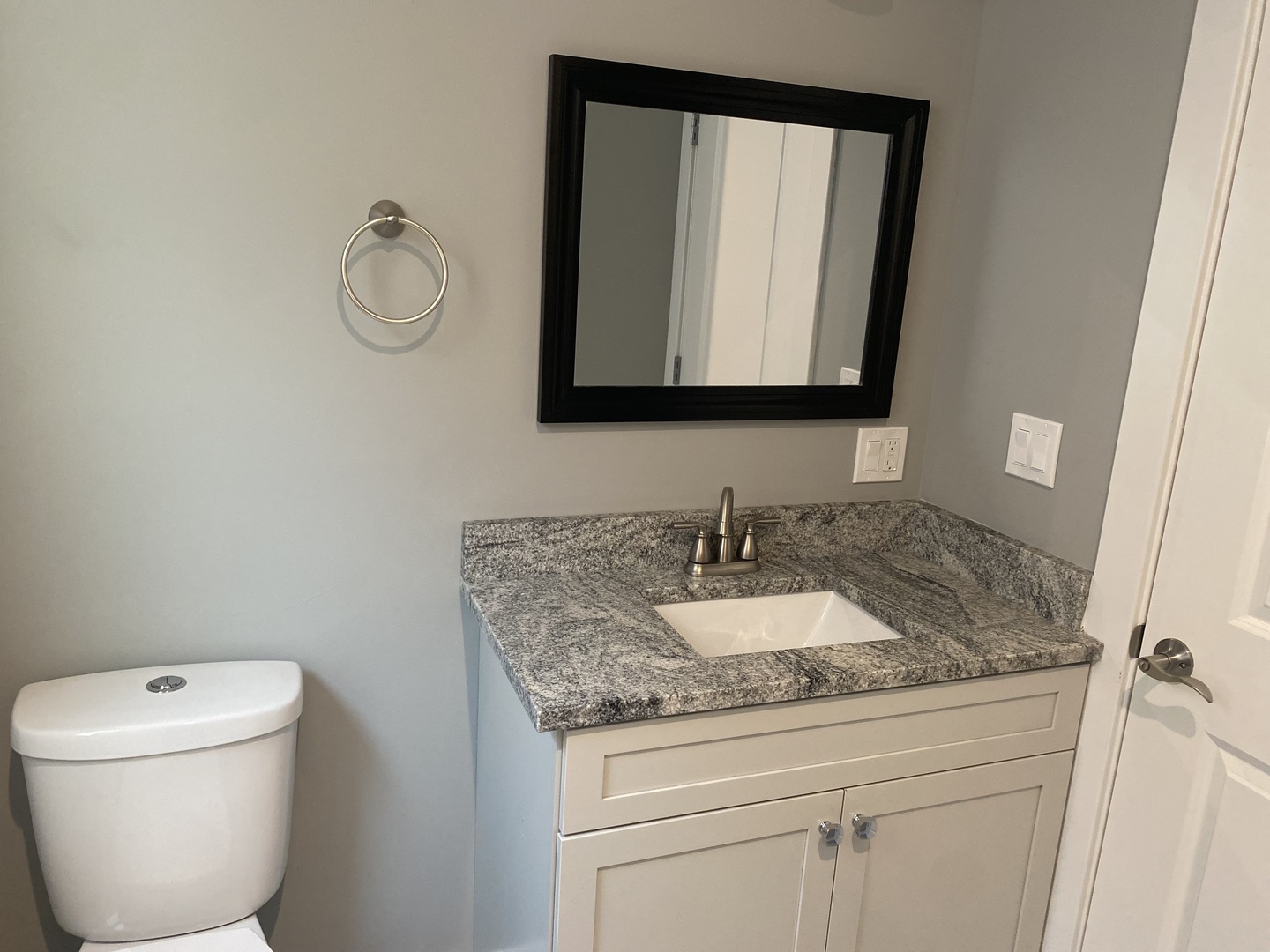 7835 South Carpenter Street Chicago, IL 60620 - Photo 10 of 17 a bathroom with a granite countertop toilet sink and mirror