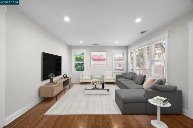 a living room with furniture or couch and a large window