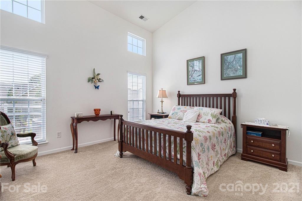 287 Garnet Court Fort Mill, SC 29708 - Photo 13 of 30 a bedroom with bed and a couch