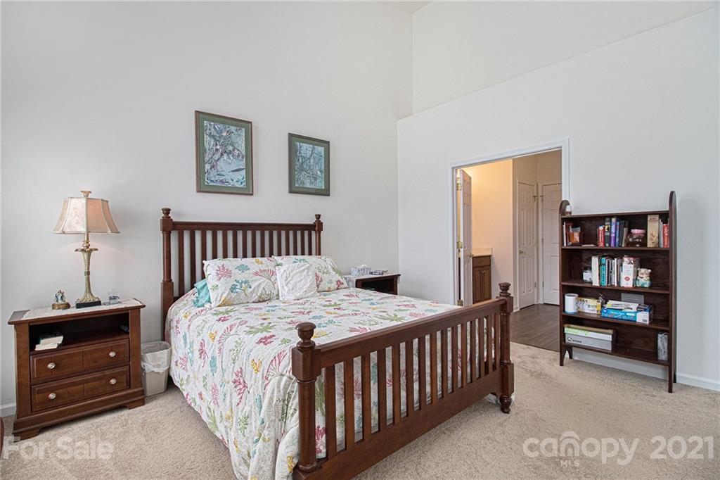 287 Garnet Court Fort Mill, SC 29708 - Photo 14 of 30 a bedroom with a bed a dresser and book shelf