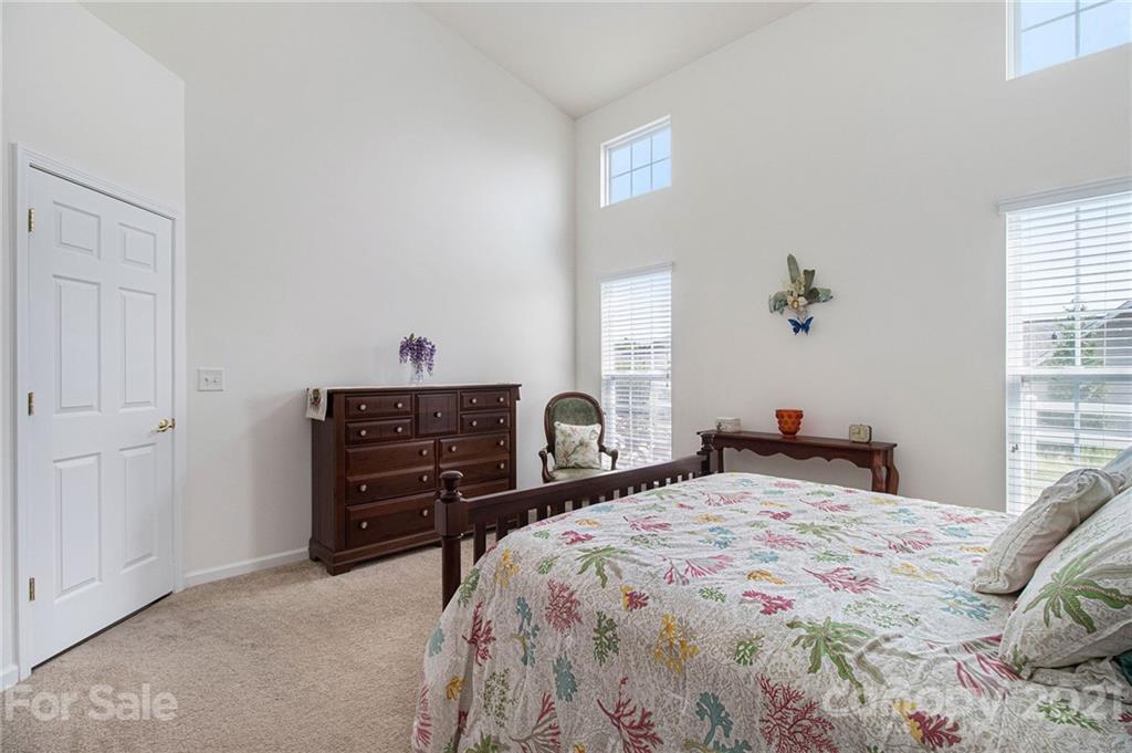 287 Garnet Court Fort Mill, SC 29708 - Photo 15 of 30 a bedroom with a bed and a dresser