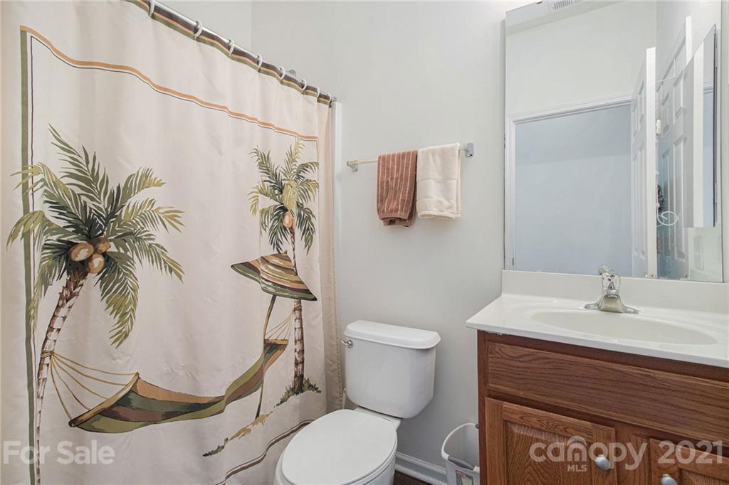 287 Garnet Court Fort Mill, SC 29708 - Photo 19 of 30 a bathroom with a sink and a mirror