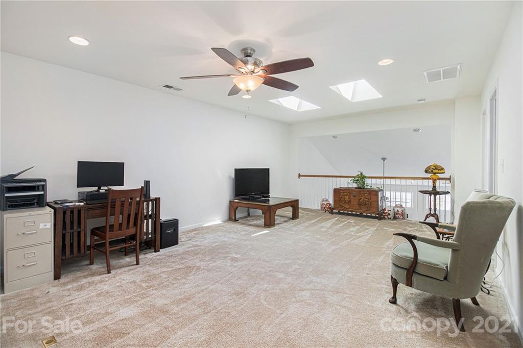 287 Garnet Court Fort Mill, SC 29708 - Photo 20 of 30 a living room with furniture and a flat screen tv