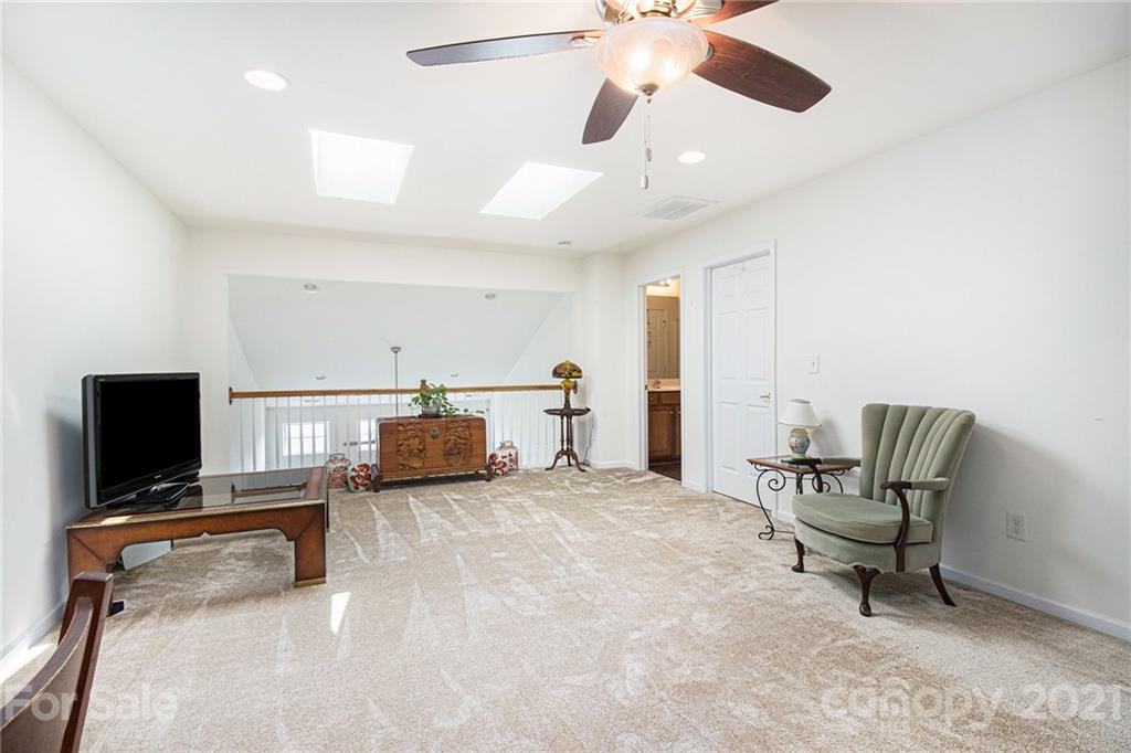 287 Garnet Court Fort Mill, SC 29708 - Photo 21 of 30 a bedroom with furniture and a flat screen tv