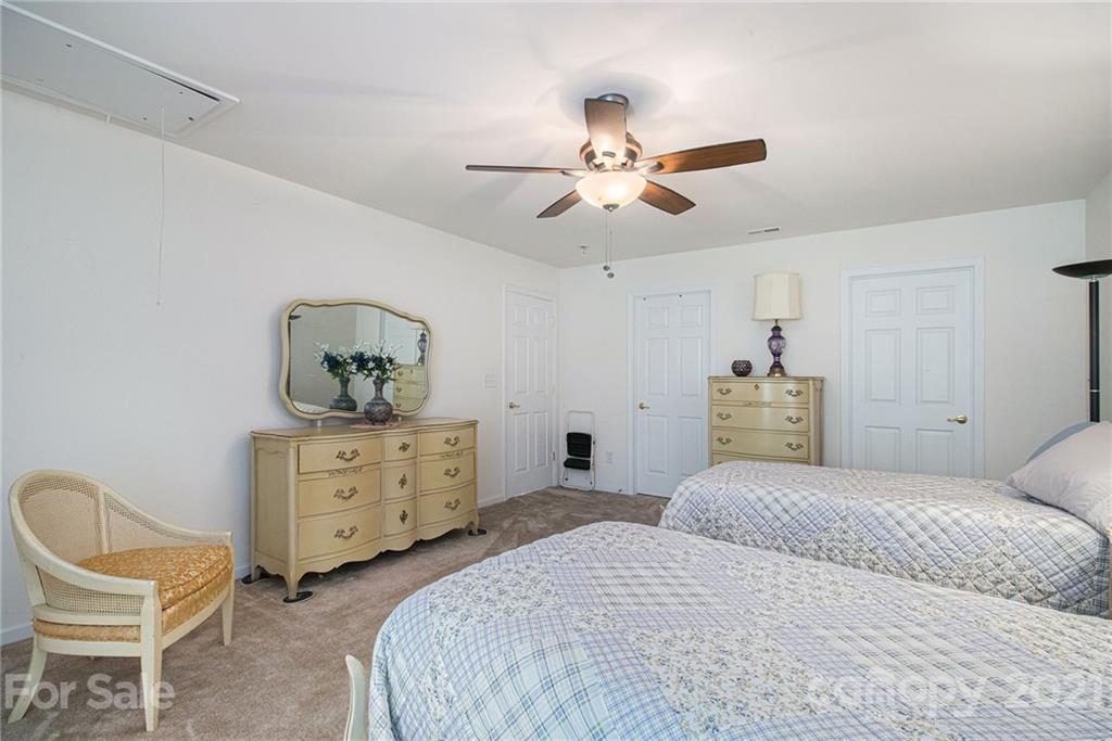 287 Garnet Court Fort Mill, SC 29708 - Photo 23 of 30 a bedroom with a bed and chair