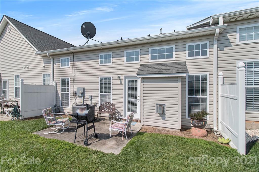 287 Garnet Court Fort Mill, SC 29708 - Photo 27 of 30 a view of a backyard with table and chairs and a barbeque