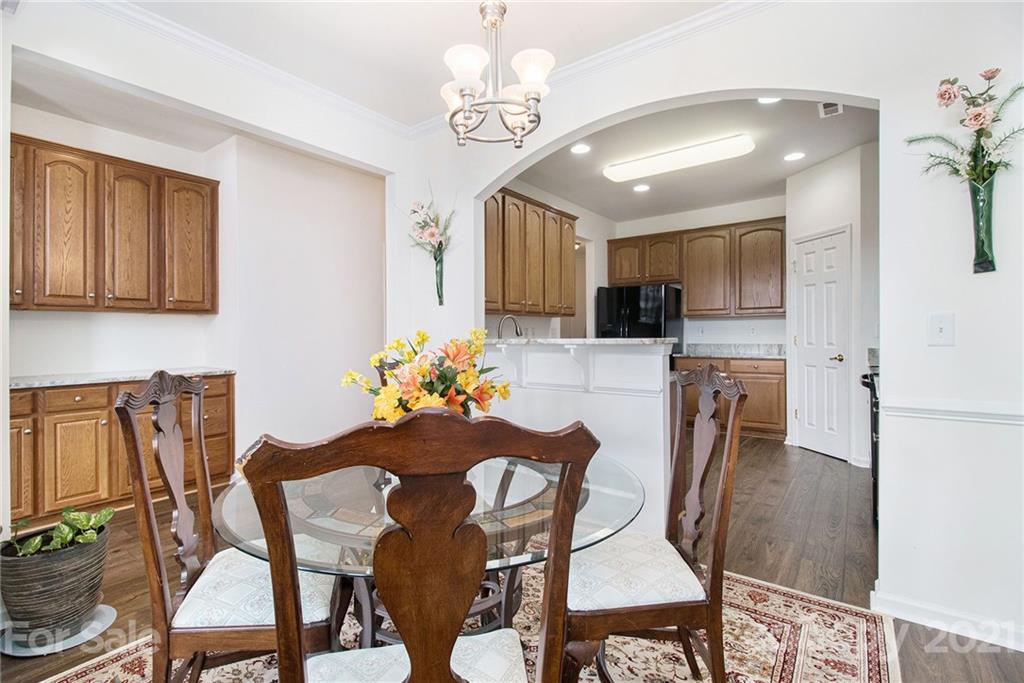 287 Garnet Court Fort Mill, SC 29708 - Photo 8 of 30 a view of a dining room with furniture and chandelier
