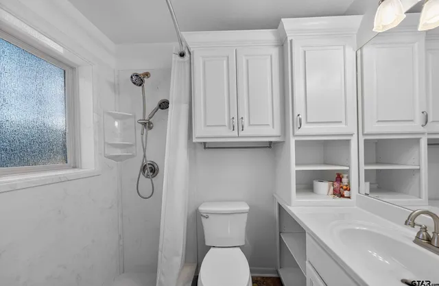 a view of a house with a yard and garage