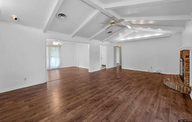 a living room with furniture a rug and a window