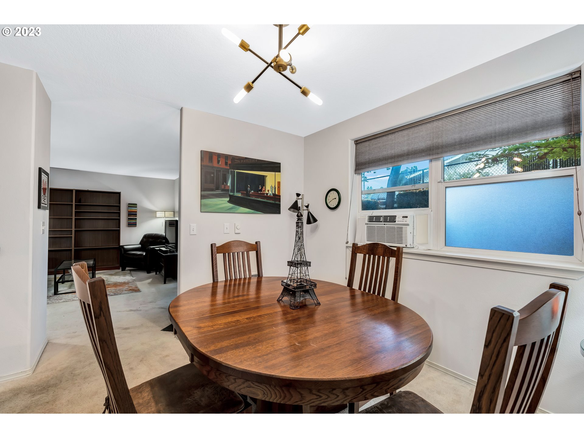 4694 West Powell Boulevard, Unit 139 Gresham, OR 97030 - Photo 11 of 29 a view of a dining room with furniture window and wooden floor