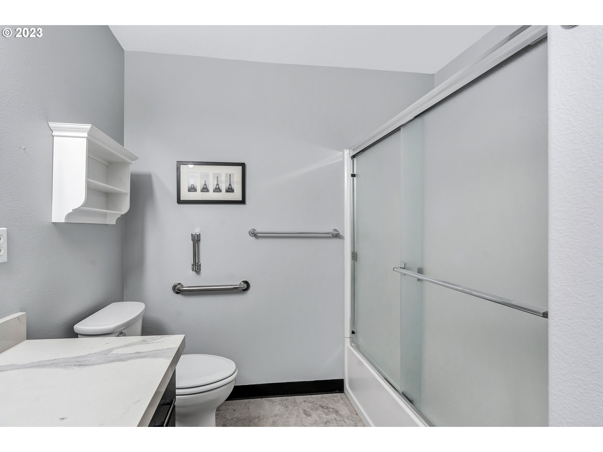 4694 West Powell Boulevard, Unit 139 Gresham, OR 97030 - Photo 22 of 29 a bathroom with a sink a toilet and a mirror