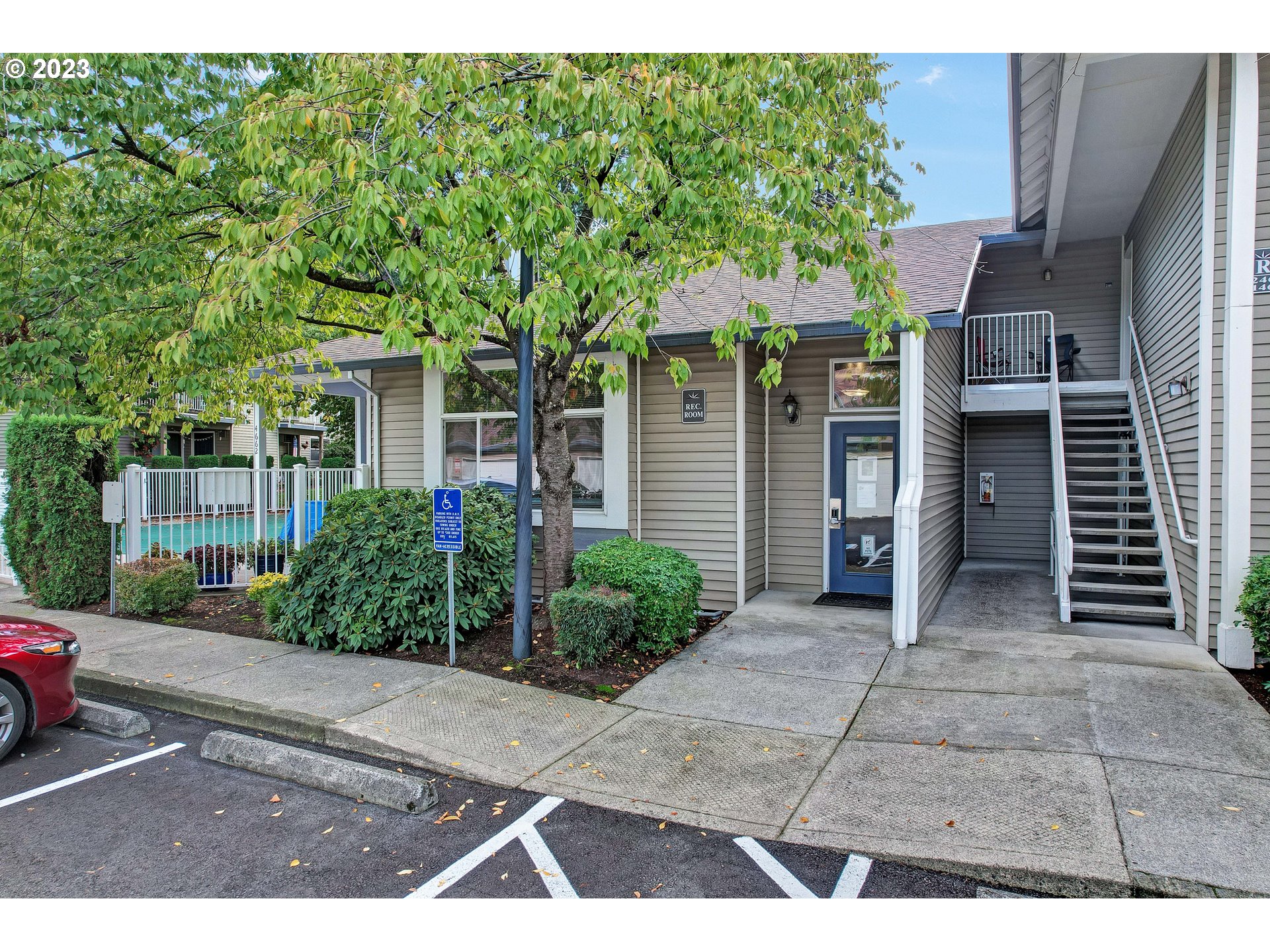 4694 West Powell Boulevard, Unit 139 Gresham, OR 97030 - Photo 28 of 29 a view of a house with a yard and potted plants
